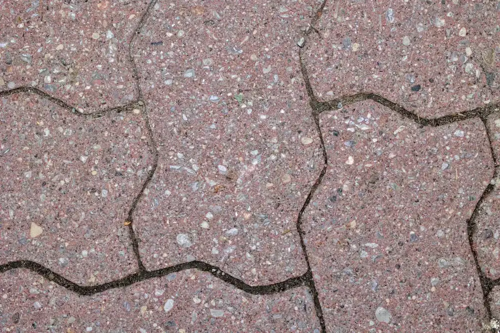 Close-up of red interlocking zigzag pavers